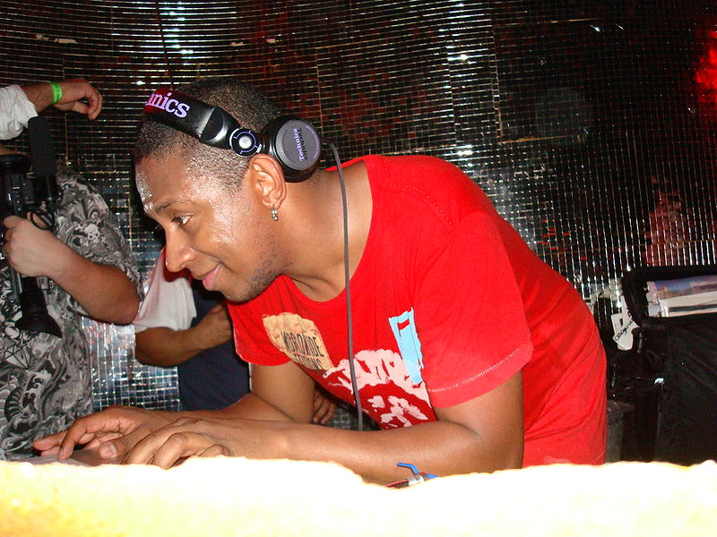 DJ Marky mixing and scratching his drum and bass sound in clubs all over the world